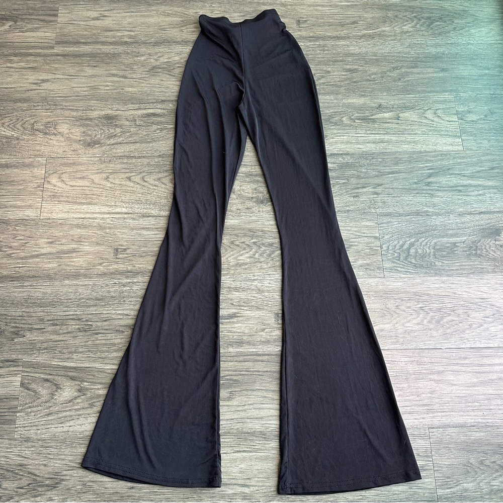 Pretty Little Thing 
Black flare ruched bum slinky